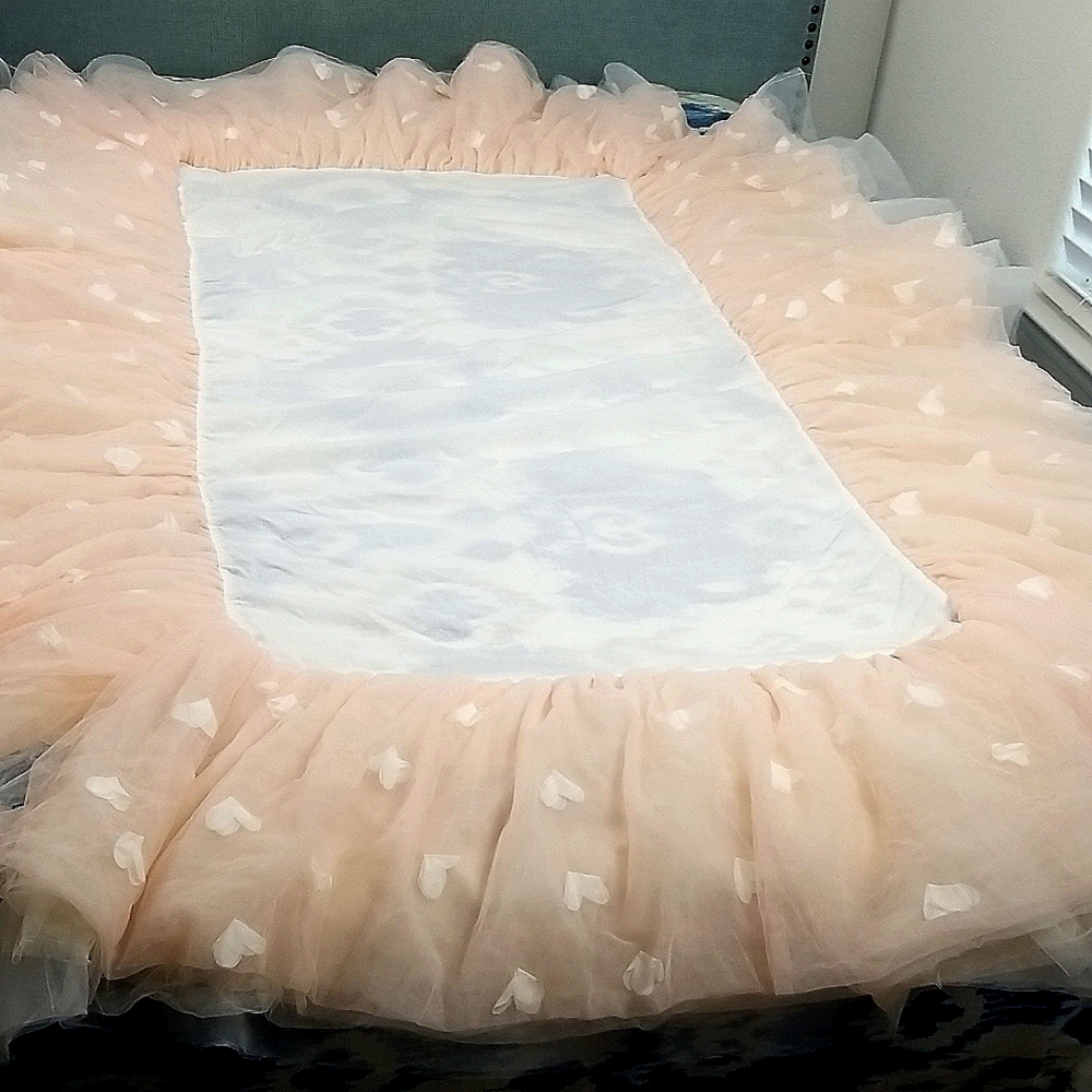 Pottery Barn Kids Crib Skirt. Pale pink and white tull.